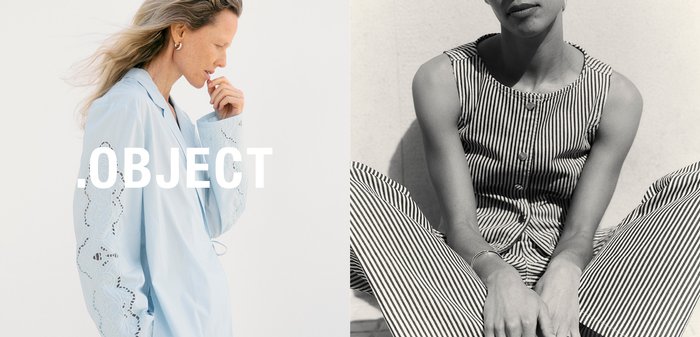 Kvinne med bølget hår i lys blå brodert bluse, hånd nær munnen, vendt sideveis mot en ensfarget lys bakgrunn med teksten "OBJECT".