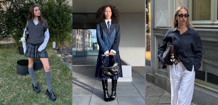 Deux femmes portant des jupes plissées et des tops superposés ; l'une avec des chaussettes grises jusqu'aux genoux et des mocassins sur l'herbe, l'autre avec des bottes noires tenant un sac à main noir sur le trottoir.