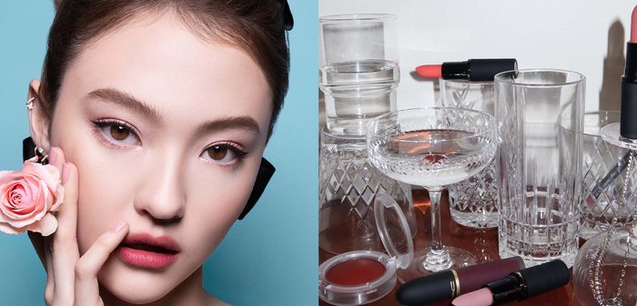 Diverses verreries et cristalleries vides avec des rouges à lèvres et un baume à lèvres placés dessus et autour, sur une surface en bois.