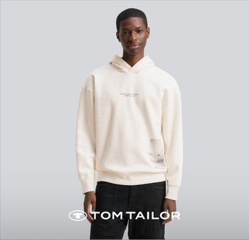 Cremefarbener Hoodie mit lockerer Passform, der einen bedruckten Schriftzug auf der Vorderseite und ein Etikett im Taschenbereich aufweist. Aus weichem Baumwollmischgewebe.