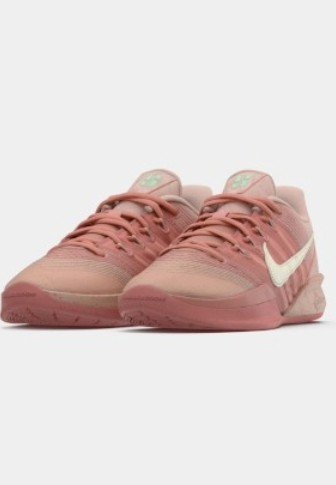 Nike'i sportjalatsid, millel on roosade toonide liugvärvitooniga pealne, võrgust ja sünteetilistest materjalidest, valge Swooshi logo ja tekstureeritud kummist tald.