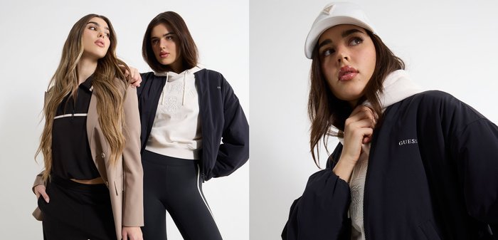 Dwie kobiety pozują w stylowych, casualowych outfitach: jedna w beżowym płaszczu i czarnym topie, druga w czarnej kurtce i białej bluzie z kapturem oraz legginsach.