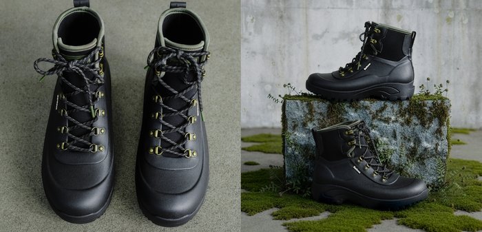 Bottes imperméables noires avec accents verts, tige structurée, système de laçage circulaire et semelle robuste, conçues pour une utilisation extérieure.