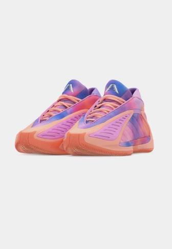 Pair of colorful athletic shoes in pink, purple, and orange tones, showing laces and textured soles on a plain background.
