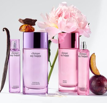 Four perfume bottles with purple and pink gradient designs. Labels read "Cocoa & Cashmere" and "Peony Picnic." Floral and fruit accents accompany.