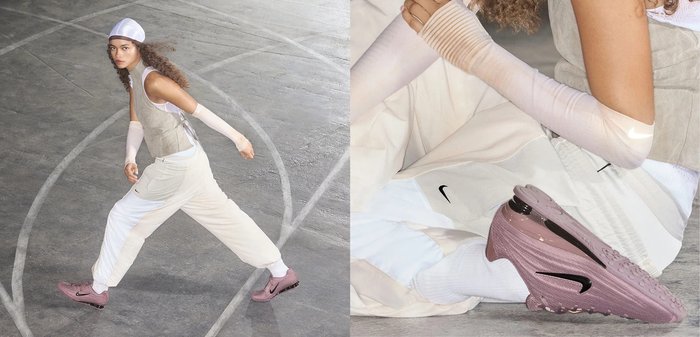 Jeune femme aux cheveux bouclés portant une tenue de sport beige et blanche, assise par terre, avec des baskets roses Nike et un bandeau blanc.
