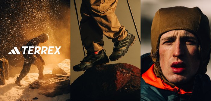 Scarpe da trekking nere con materiale testurizzato, lacci e suola in gomma Continental. Pantaloni marroni e un berretto marrone indossati da una persona in un ambiente innevato.