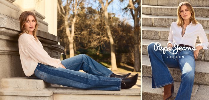 Woman wearing blue jeans and light tops, seated on outdoor stone steps with trees in the background, posing for fashion brand Pepe Jeans.