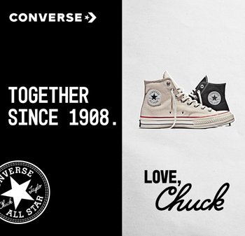 Zapatillas altas de lona en beige y negro, con cordones blancos y suelas de goma. Parche con el logo de estrella en ambos lados. El texto dice: "Juntos desde 1908."