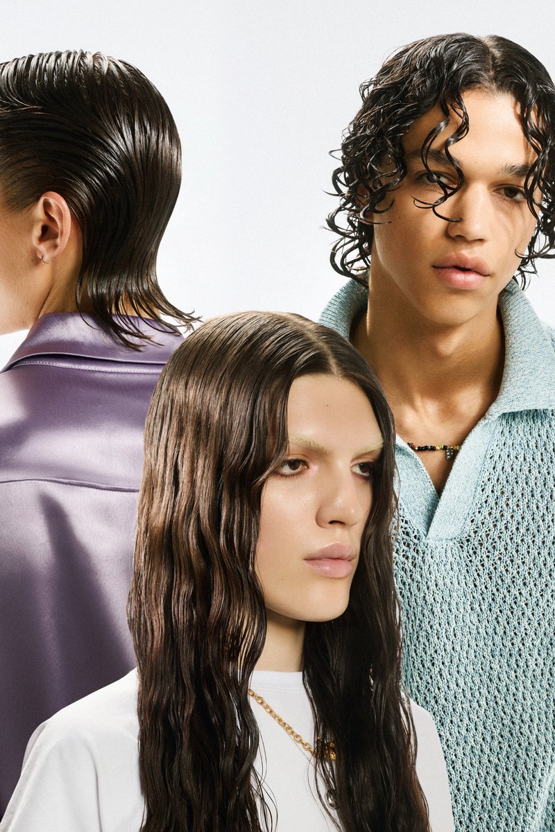 Three young adults showcase diverse hairstyles: a slicked-back look, long wavy hair, and short curly hair, wearing stylish clothing against a light backdrop.