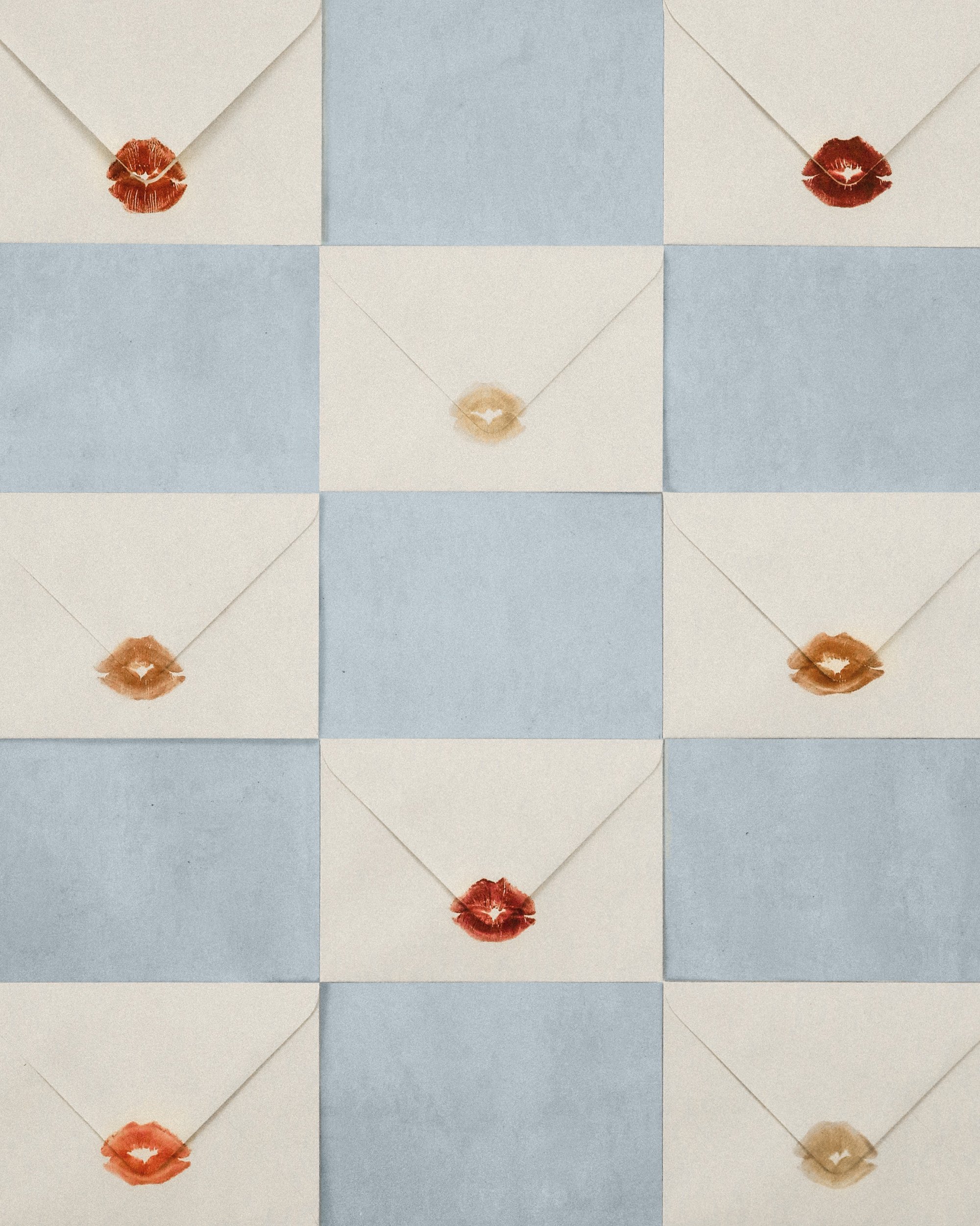 Nine envelopes arranged in a grid, each sealed with colorful lipstick prints in shades of red, orange, and beige on a textured blue background.