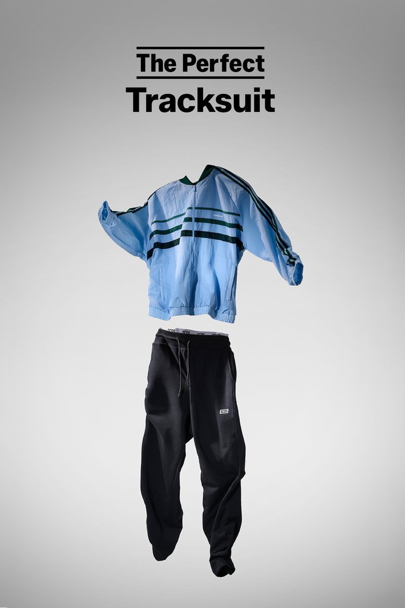 Light blue tracksuit jacket with green stripes and black sweatpants displayed against a gray background, labeled "The Perfect Tracksuit."