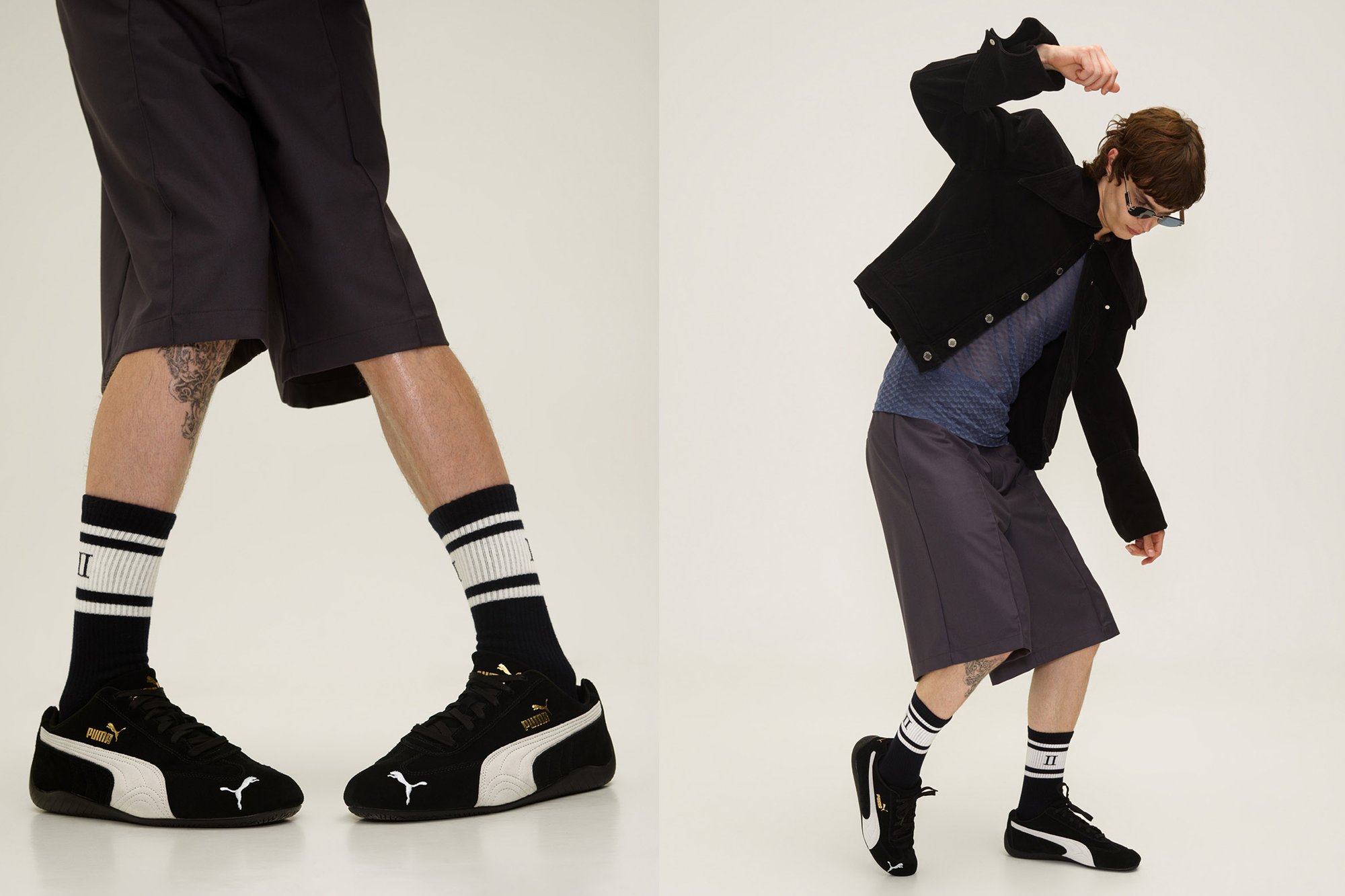 Chaqueta de ante negra, camisa azul texturizada, pantalones cortos grises, zapatillas negras con detalles en blanco y dorado, y calcetines a rayas. Enfoque en el estilo casual moderno.