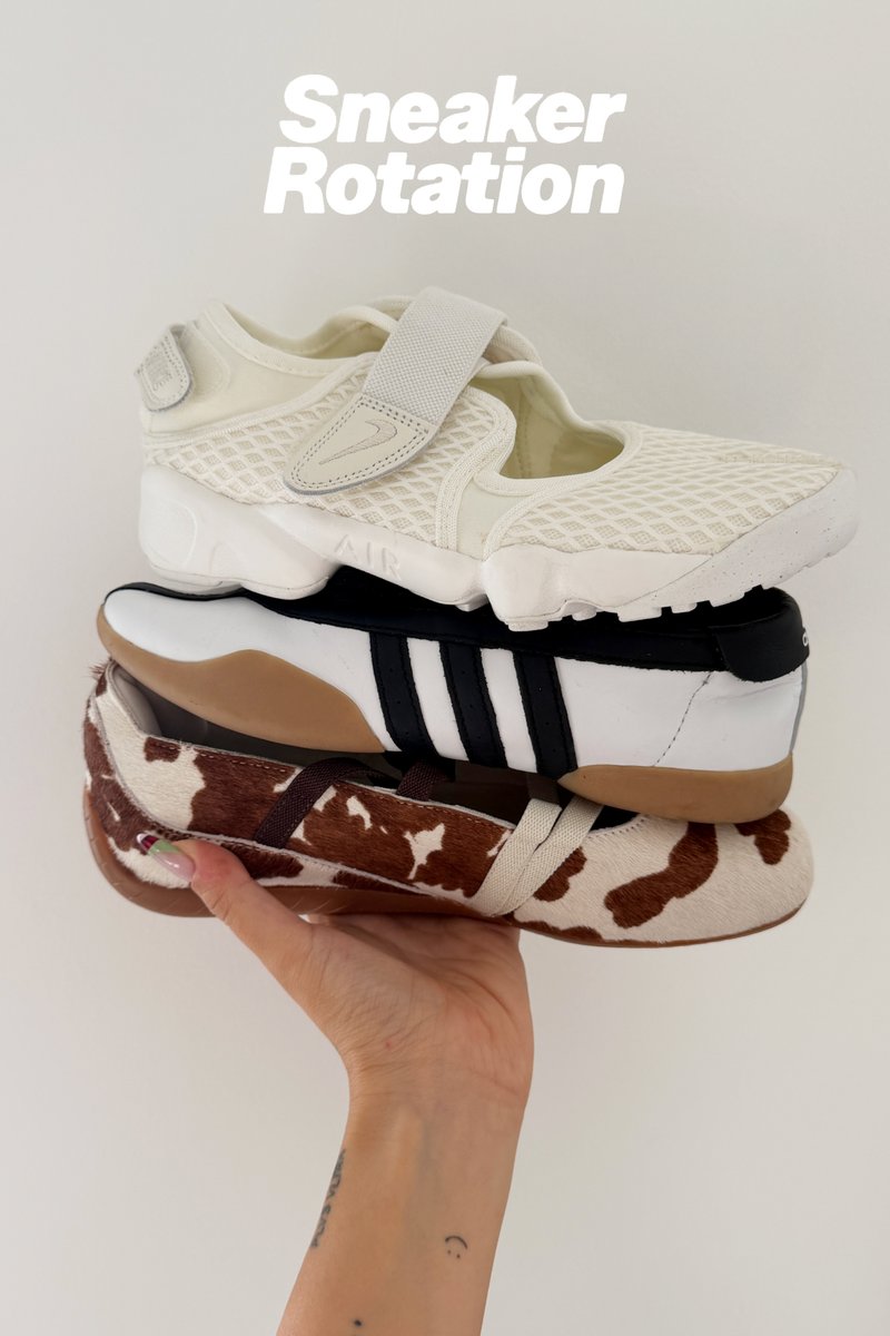 Stacked trainers: white mesh with Velcro, black leather with three stripes, and brown cow print with a smooth texture.