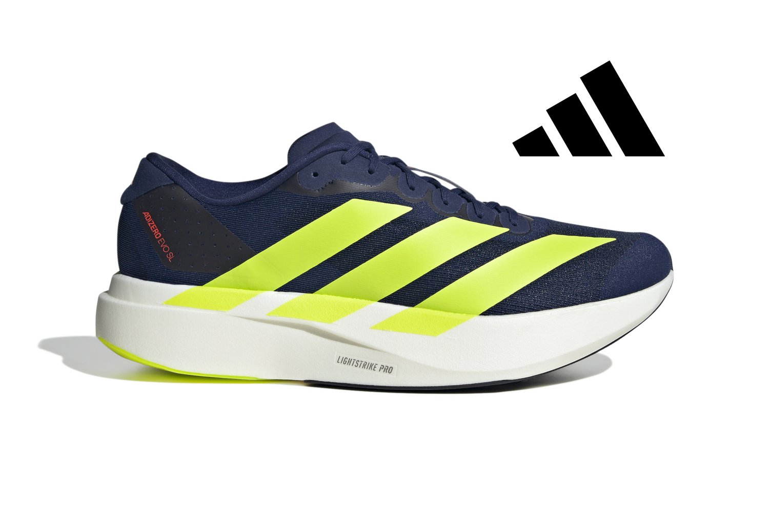 Zapatilla atlética marinera con franjas amarillas brillantes, que presenta un diseño elegante y una suela blanca prominente. Logo de Adidas visible en el lado.