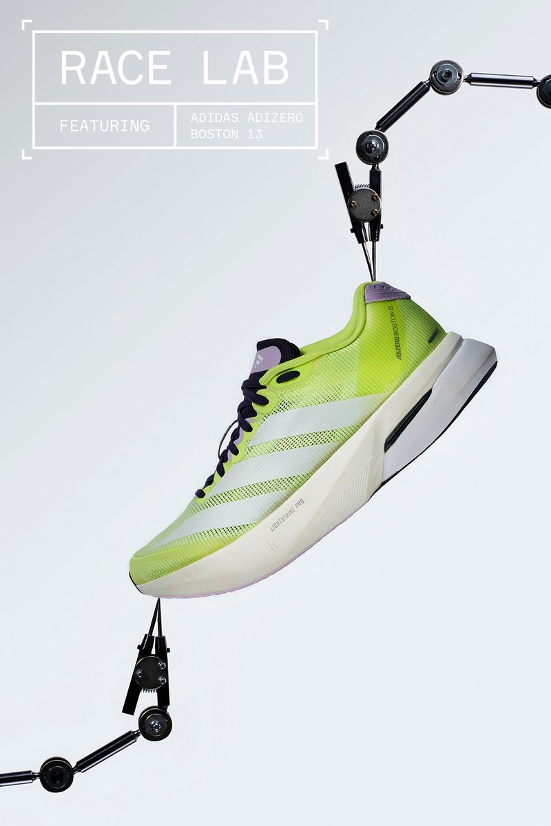 Neongelber Adidas Adizero Boston 13 Laufschuh, gehalten von mechanischen Armen vor einfachem Hintergrund, mit dem Text "RACE LAB".