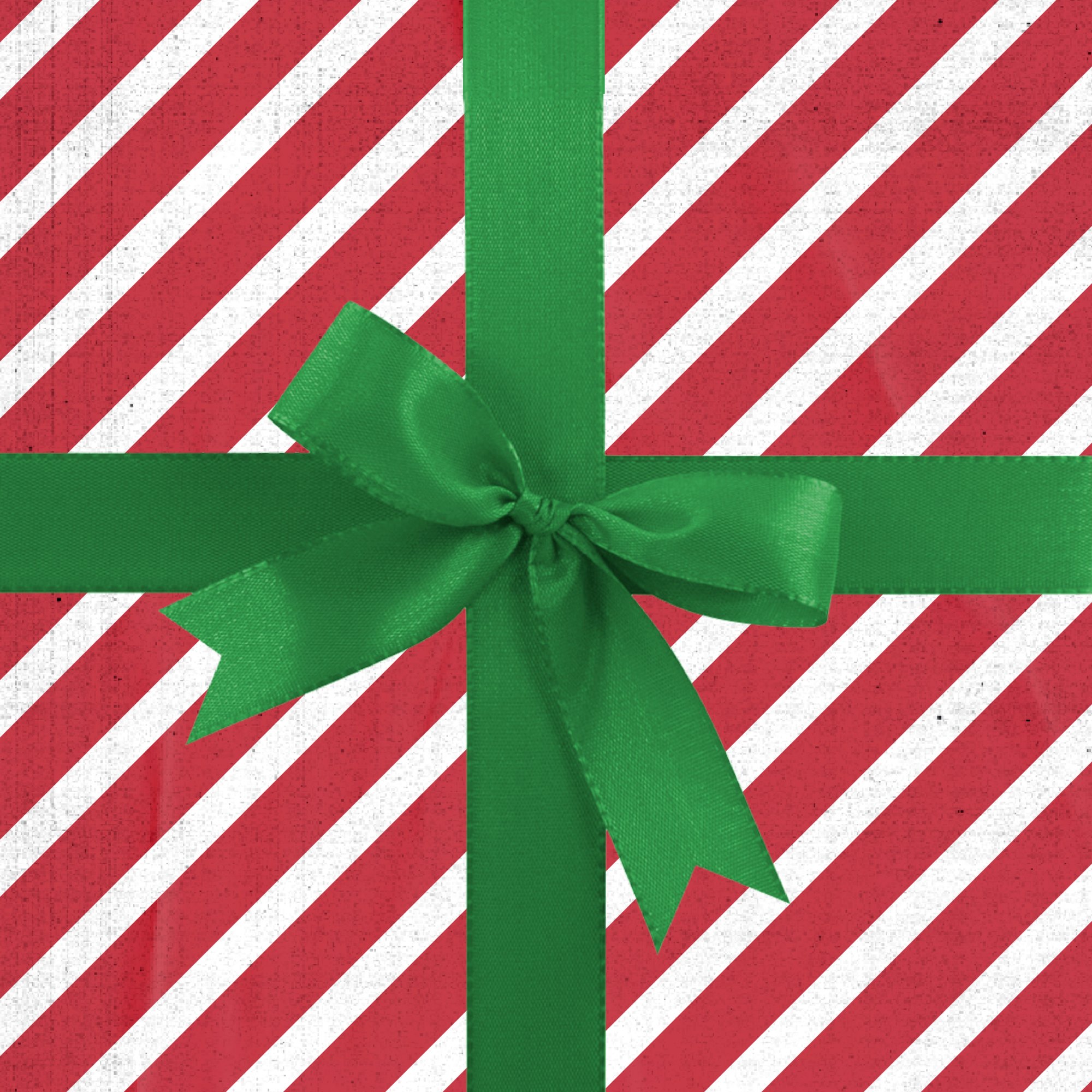 Scatola regalo a righe rosse e bianche decorata con un grande fiocco verde al centro, creando un tema festivo per le feste.