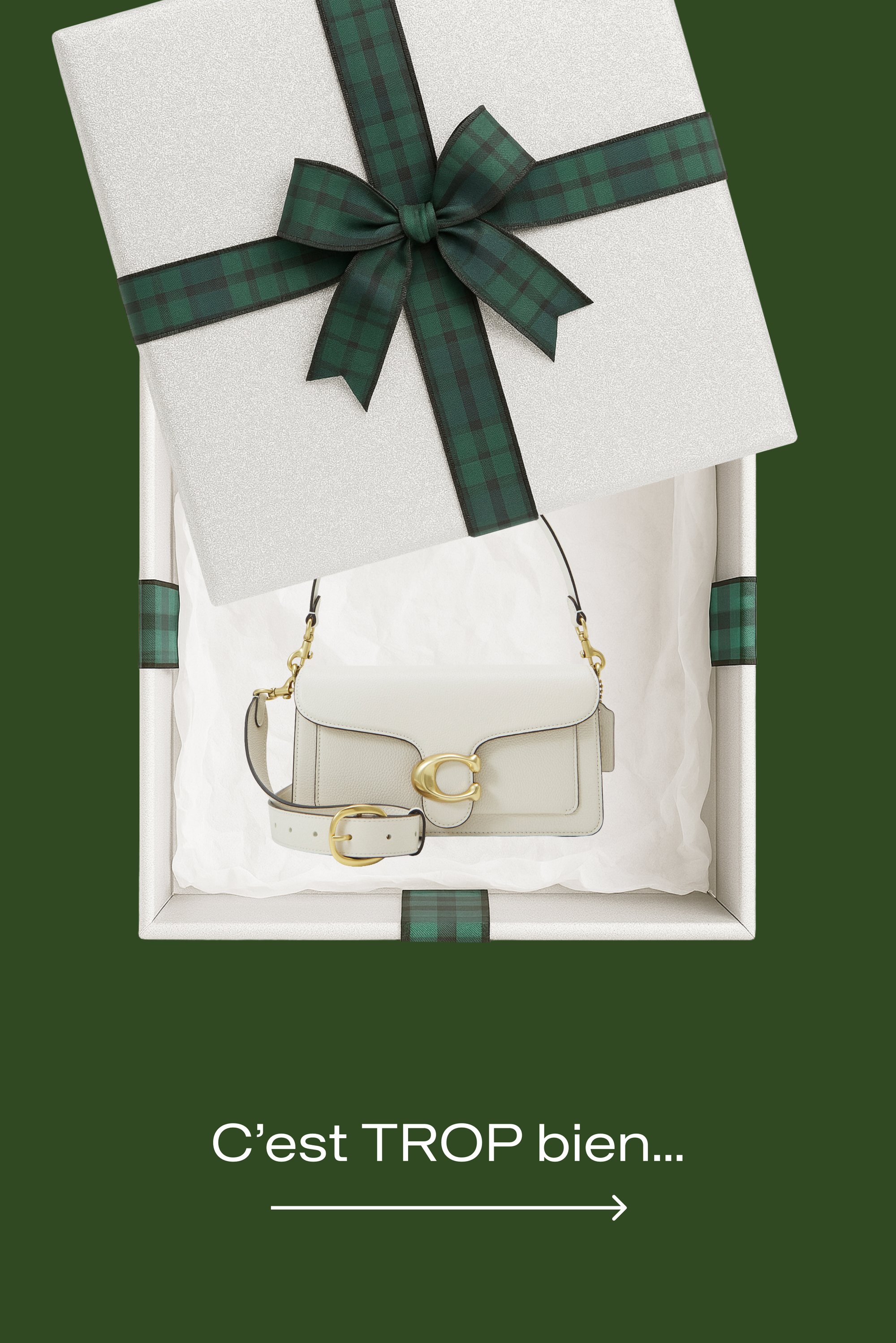 Sac à main en cuir blanc avec garniture dorée, placé dans une boîte cadeau blanche avec un ruban vert à carreaux. Le texte en dessous indique, "C’est TROP bien..."