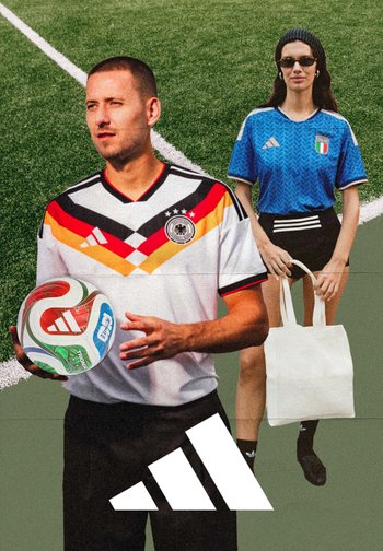 Two individuals on a sports field. One wears a white, red, and black striped soccer jersey, holding a multicolored soccer ball; the other in a blue jersey.