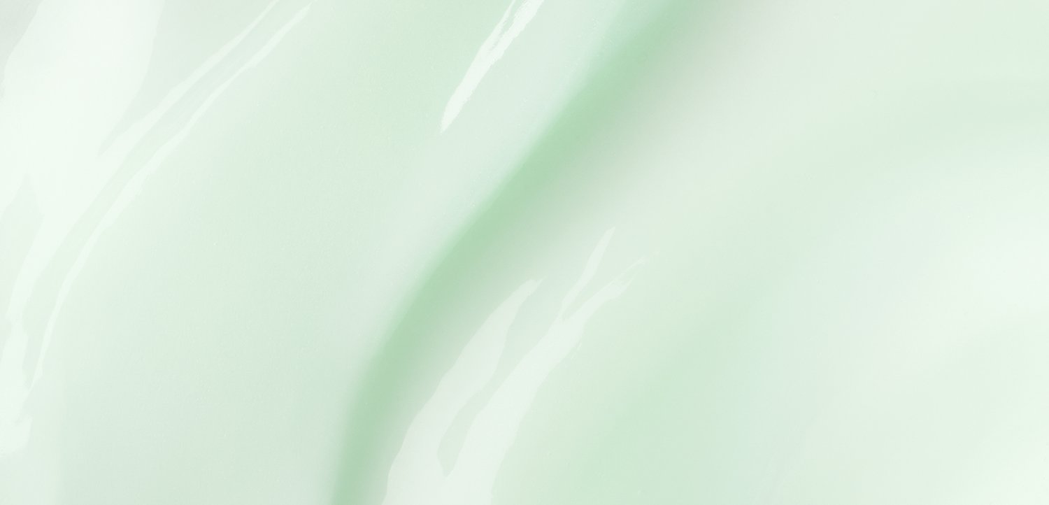 Zachte, vloeiende mintgroene oppervlakte met subtiele lichtreflecties en zachte rondingen, die een kalmerend en rustgevend visueel effect creëren.