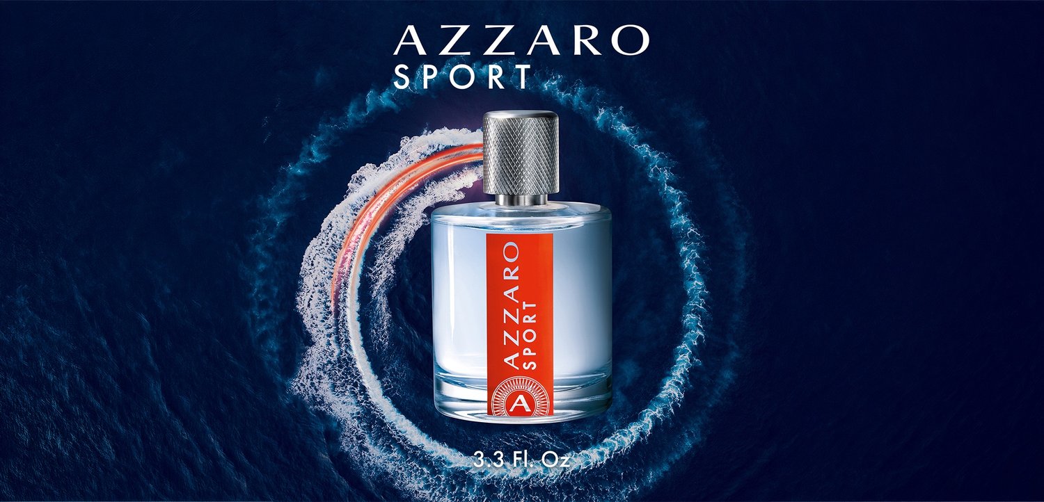 Azzaro Sport cologne bottle with silver cap and red label, centered inside circular water splash on dark blue background.