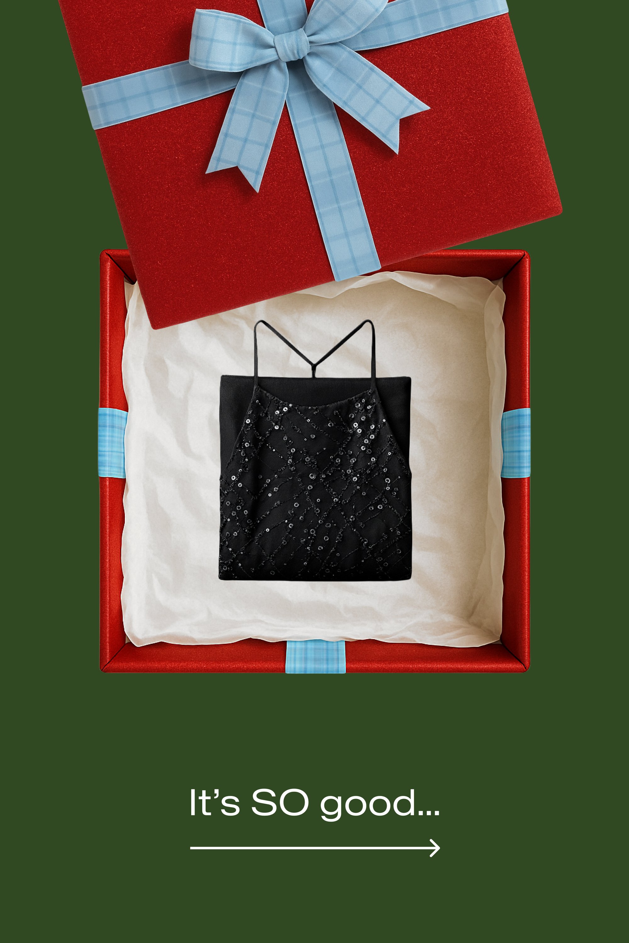 Camisole nera con paillettes e spalline sottili, posata in una scatola regalo rossa foderata di tessuto bianco. La scatola è decorata con un nastro a quadretti blu.