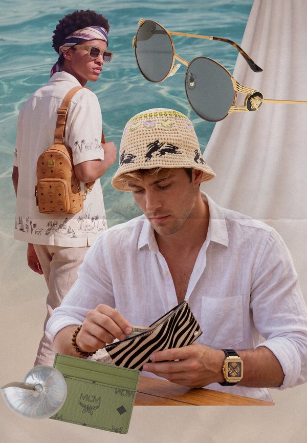 Homme en chemise blanche portant un bob à motifs tenant un portefeuille à rayures zèbre, avec un autre homme en lunettes de soleil et sac à dos près d'une piscine.