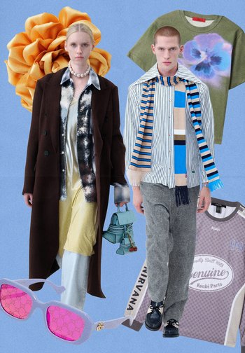 Dva modeli nosita različna oblačila: rjav plašč, prugasta srajca in vzorčaste hlače, dopolnjena z rožnatimi sončnimi očali in zeleno torbico.