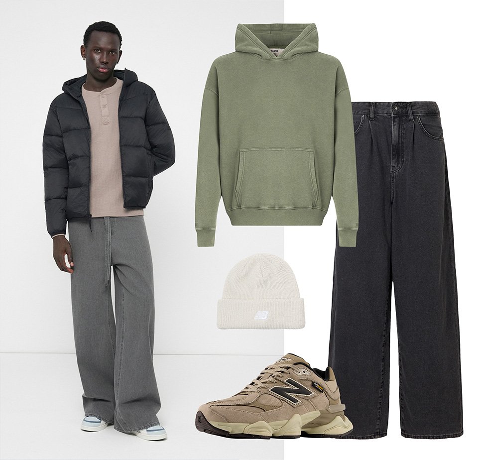 Doudoune noire, sweat à capuche vert olive, jean large gris, beanie beige, et baskets marron New Balance exposés ensemble.