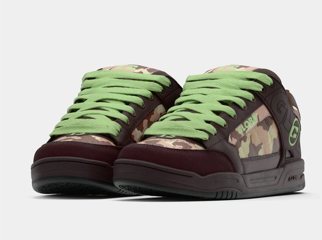 Pair of low-top sneakers with brown and beige camouflage pattern, green laces, and thick black soles.