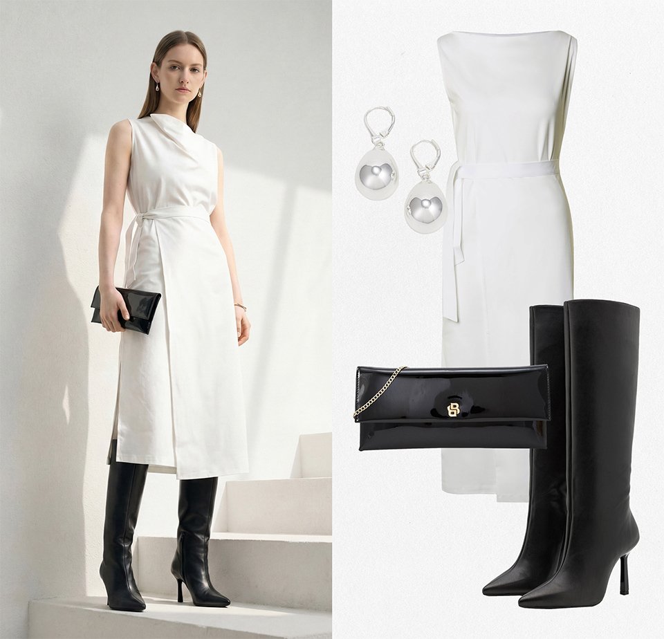 Kvinde iført hvid, ærmeløs midi-kjole med sideslids, sorte knæhøje støvler med hæl, holder en sort clutch; kombineret med sølvøreringe.