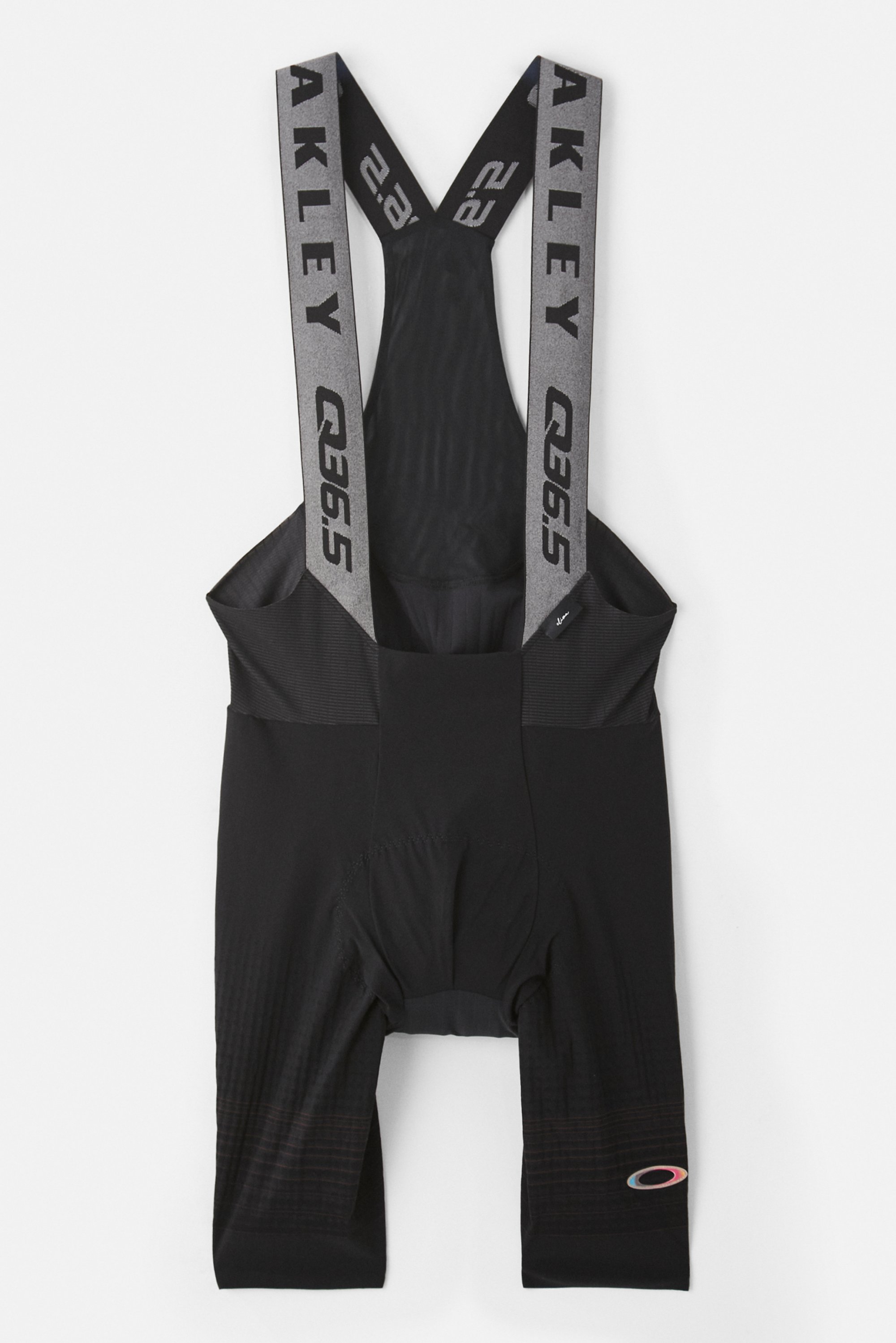 Black cycling bib shorts with branded elastic suspenders, featuring a padded seat area, designed for comfort during bike rides.