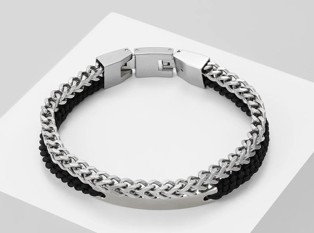 Men's bracelet with silver chain and black braided cord, featuring a silver clasp and an empty rectangular ID plate.