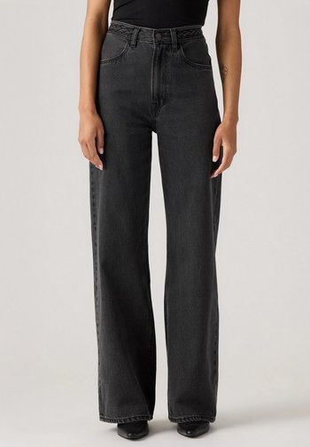 Høytlivte, vide jeans i mørk grå denim, med beltehemper, frontlommer og knappelukking.