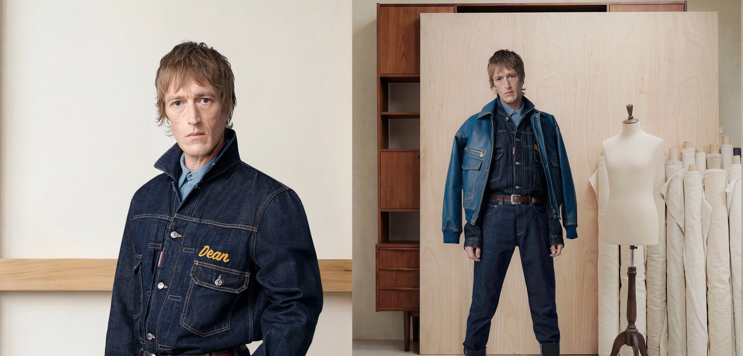 Hombre con cabello corto que lleva una chaqueta y pantalones de mezclilla azul oscuro, de pie junto a un maniquí con rollos de tela en un estudio.