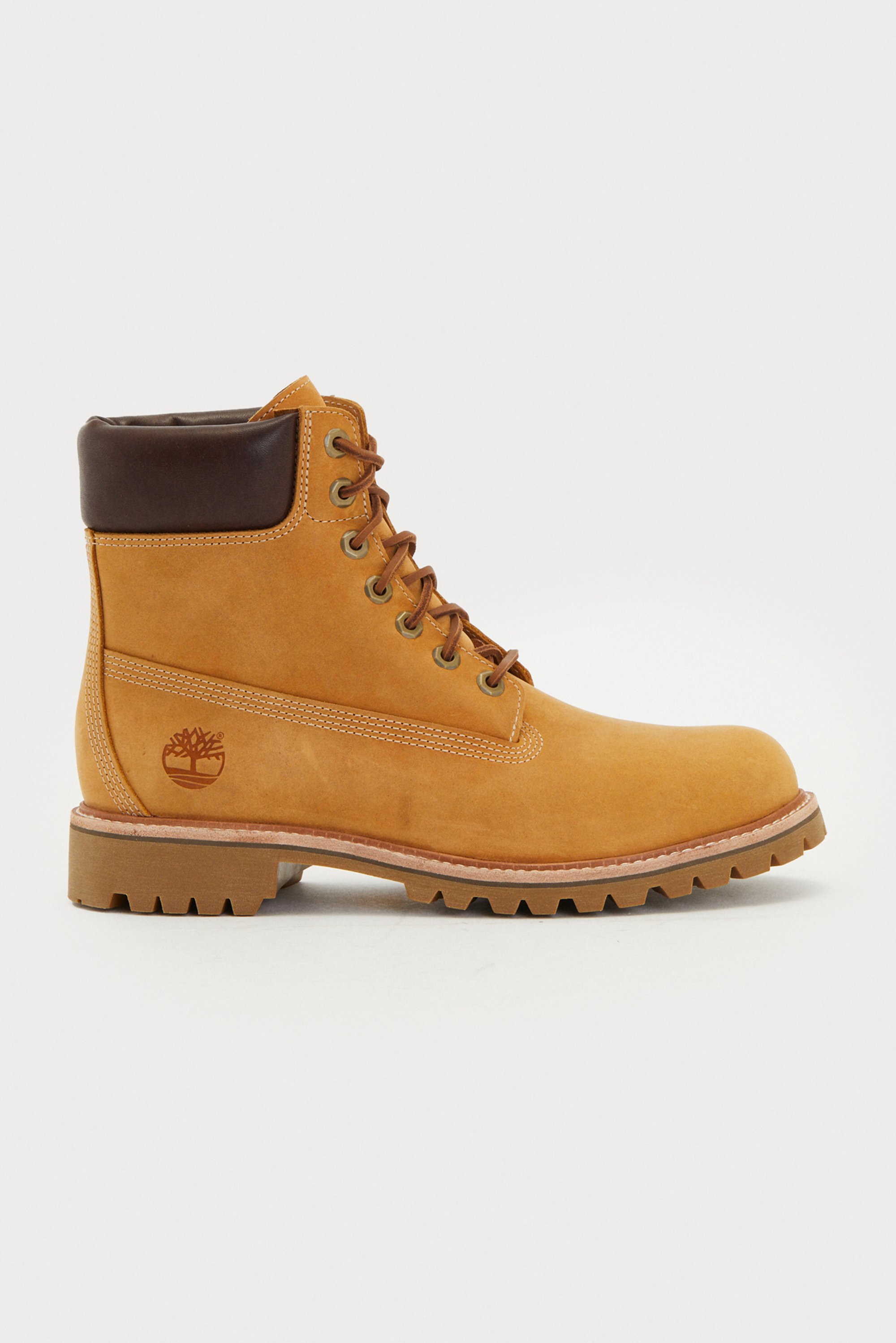 Tan leather boot with a brown padded collar, lace-up design, round toe, and textured rubber sole featuring pronounced treads and logo detail.