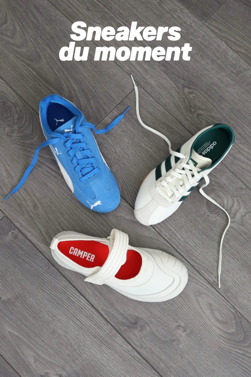 Trois baskets distinctes sur un sol en bois : une Puma bleue, une Adidas blanche avec des rayures vertes, et une sandale Camper blanche avec un intérieur rouge.