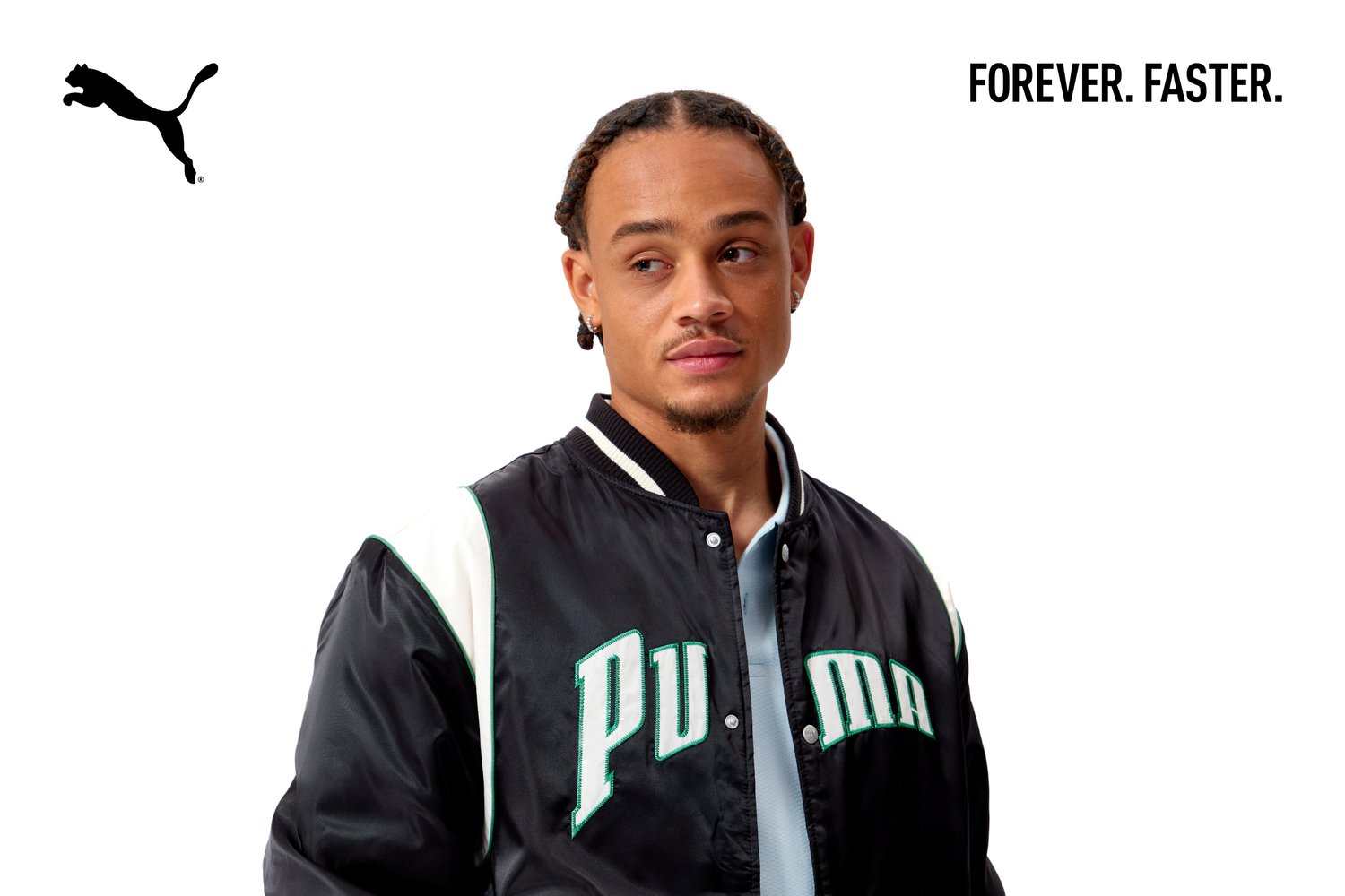 A young man with braided hair wears a black jacket with "PUMA" in green. The background is white, featuring the text "FOREVER. FASTER."
