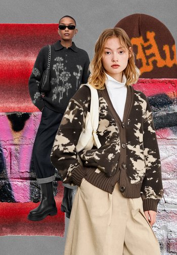 Brūns un krēmkrāsas rakstaina kardigāna ar pogām, valkāts pār baltu augstu apkakli. Melnas plašas bikses un potītes zābaki papildina apģērbu.