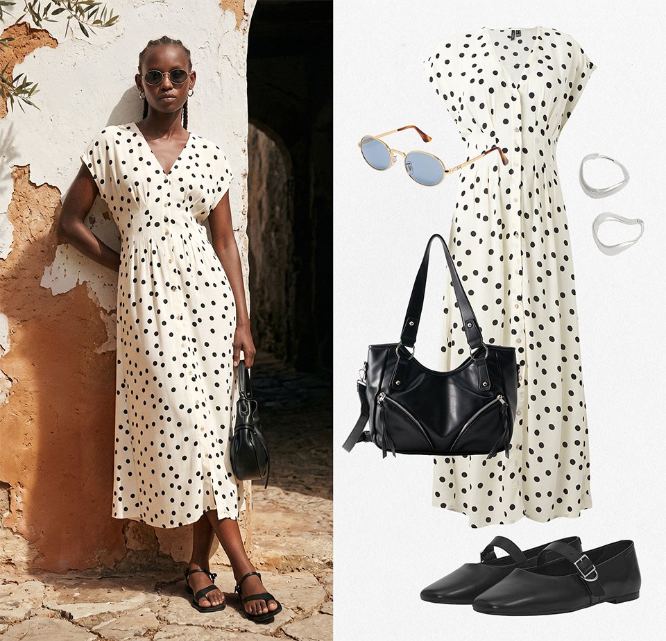 Donna che indossa un abito midi bianco a pois neri, sandali neri, occhiali da sole, tiene una borsa nera; mostrati abito, scarpe, borsa, occhiali da sole e orecchini coordinati.