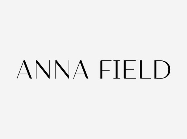 Black text "ANNA FIELD" on a plain white background, showcasing a simple and modern logo design for a fashion brand.