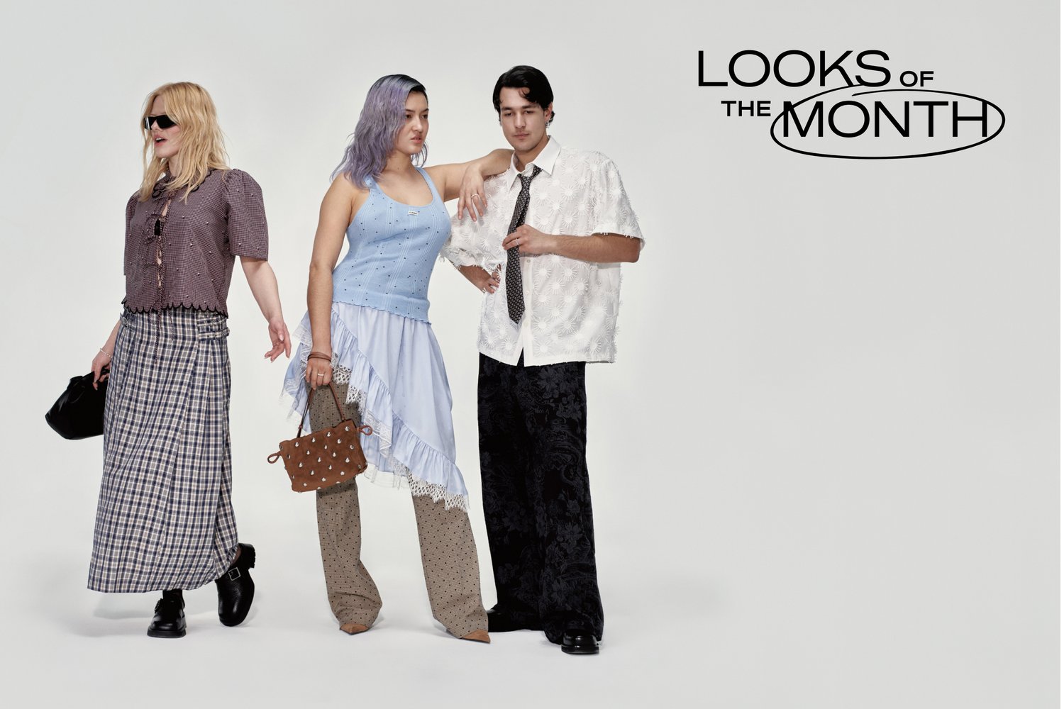 Three individuals showcase diverse fashion looks: one in a checked top and long skirt, another in a blue tank and layered skirt, and a man in a floral shirt and wide pants.