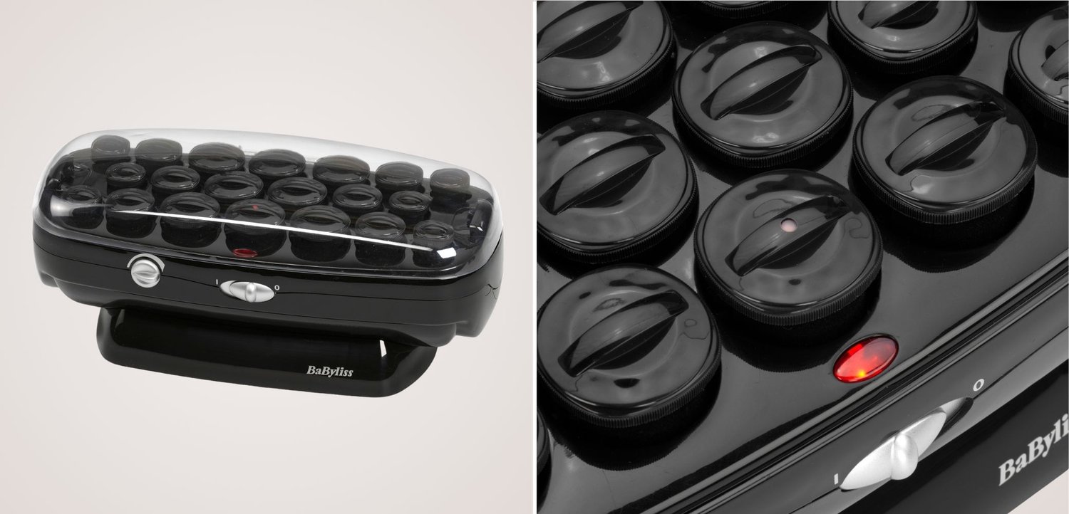 Set haarrollers met zwarte verwarmde rollers onder een doorzichtige plastic kap en een rood stroomindicatie lampje op de zwarte basis.