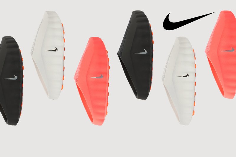 Nike-Schuhe in Schwarz, Weiß und lebhaftem Korallenrot. Sie verfügen über glatte, strukturierte Obermaterialien mit auffälligen Swoosh-Logos und einem markanten Sohlen-Design.