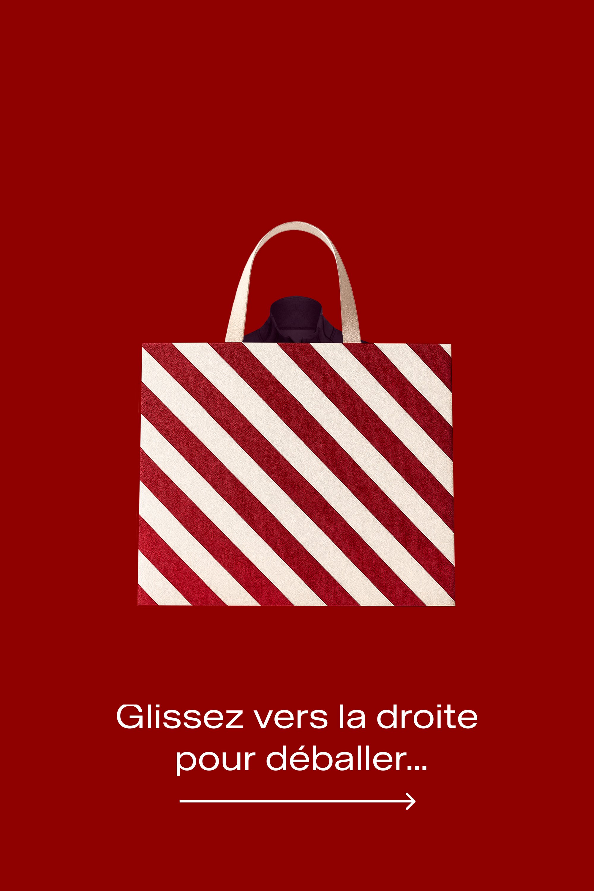 Sac fourre-tout rayé rouge et blanc, en matériau texturé, avec deux anses et un intérieur uni. Le fond est d'un rouge uni.