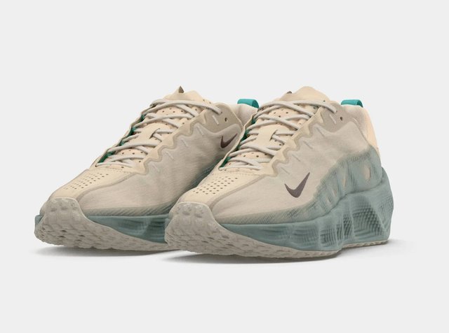 Sapatilhas Nike beje com um upper texturizado, detalhes em azul-turquesa e sola de borracha translúcida com um padrão de ondas único.