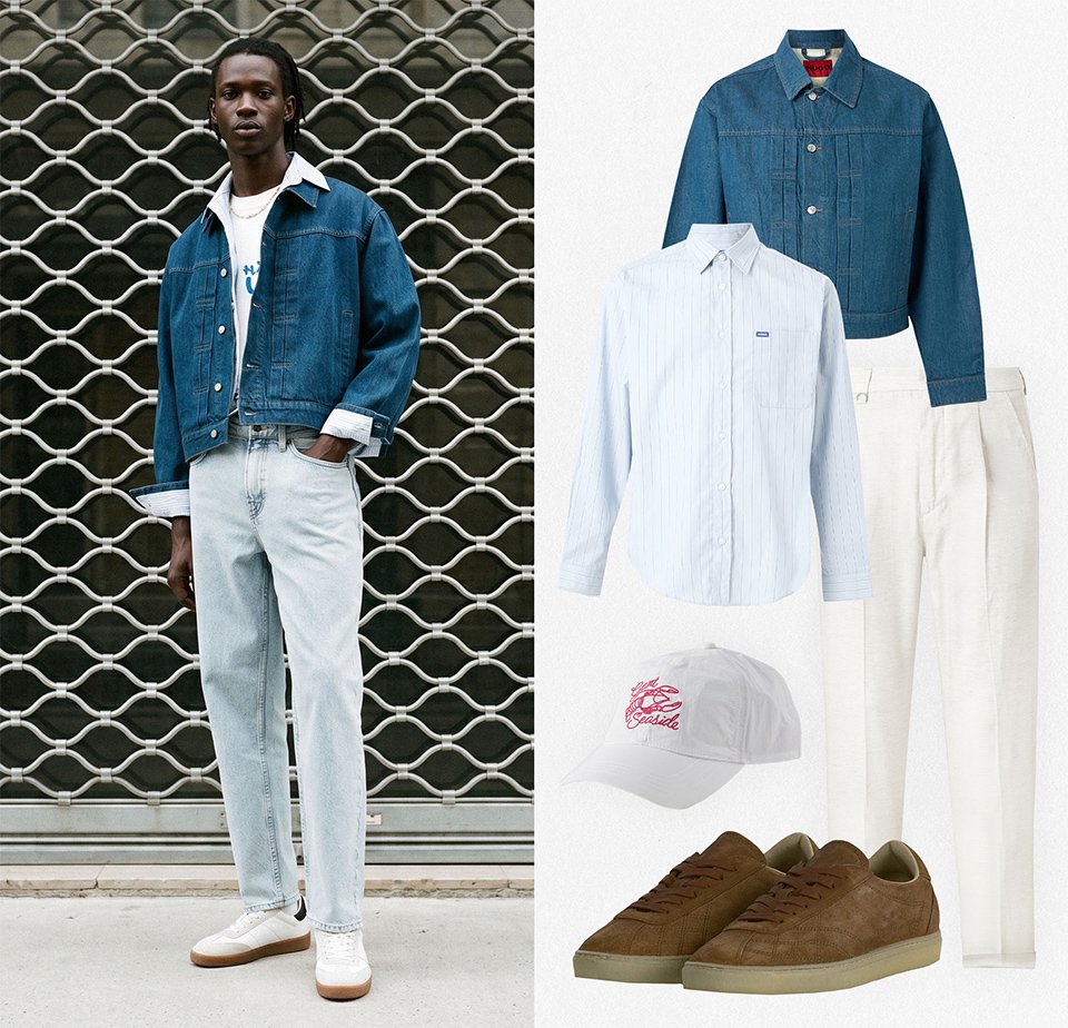 Man met een blauwe spijkerjasje, lichte jeans, wit hemd, witte sneakers; kledingstukken omvatten spijkerjasje, wit hemd, beige broek, pet, riem en bruine sneakers.