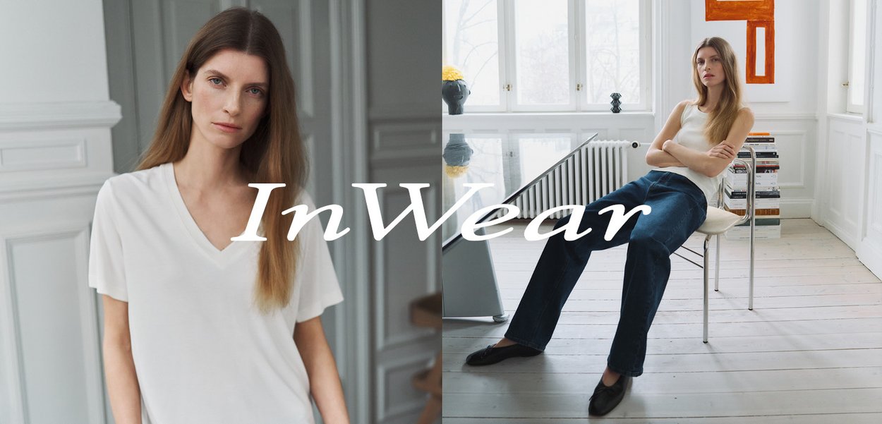 White short-sleeve V-neck T-shirt on the left, model in a ribbed sleeveless top and dark blue jeans on the right; light-filled indoor setting.