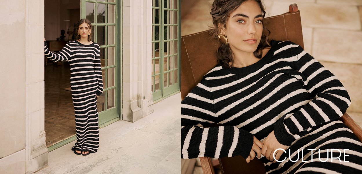 Long striped dress in black and white knit fabric, featuring a relaxed fit and long sleeves, with a soft, textured surface and crew neckline.