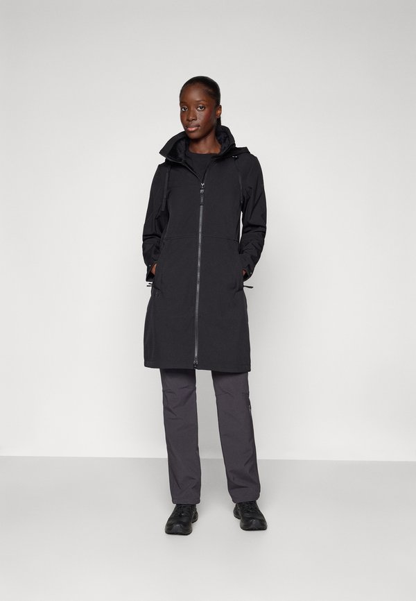 Black waterproof coat with zip closure, adjustable hood, and two side pockets, paired with gray pants and black shoes. Minimalist design.